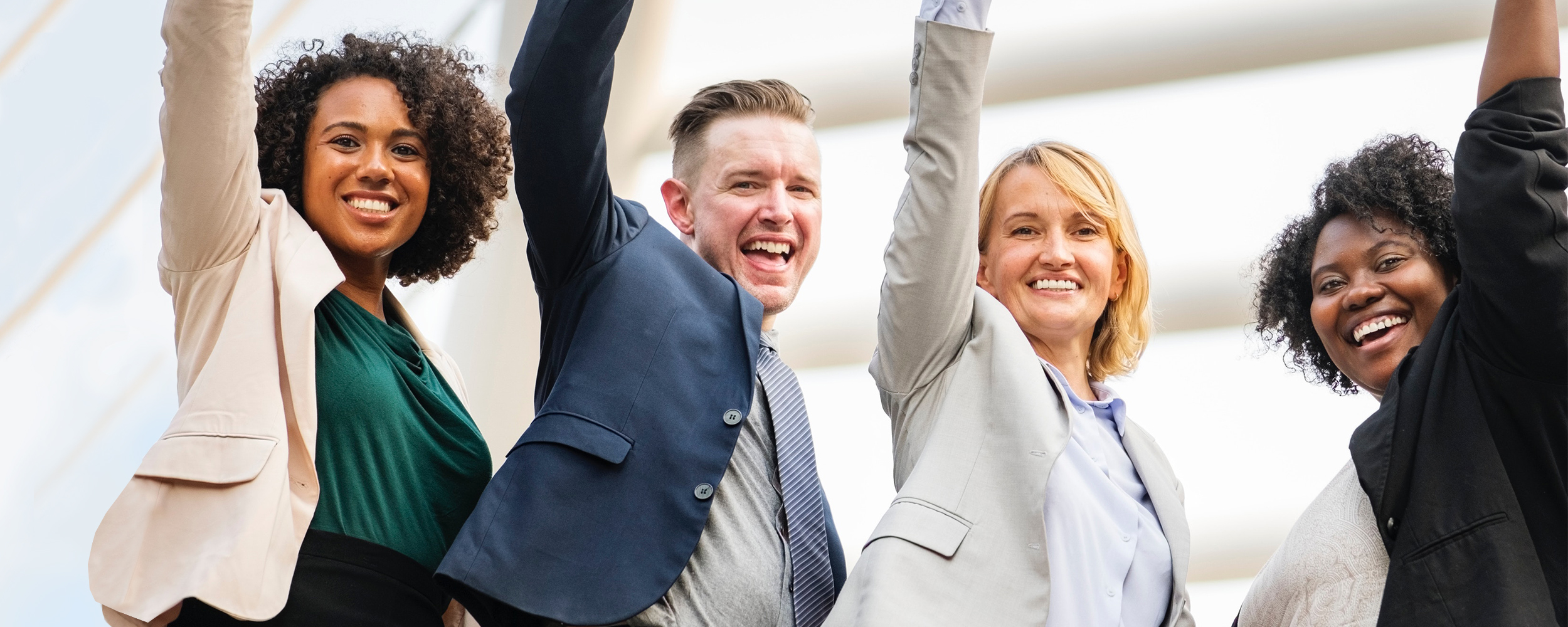 Employees raising hands